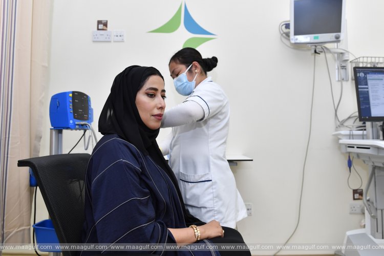 Mona Al Marri and her mother receive first dose of Pfizer-BioNTech vaccine